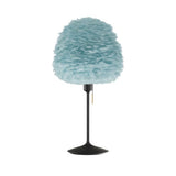 Eos Evia Table Lamp by Umage – Medium, Lampshade Blue, Table stand Black installed in the living room or bedroom