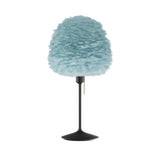 Eos Evia Table Lamp by Umage – Medium, Lampshade Blue, Table stand Black installed in the living room or bedroom