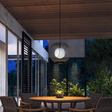 Kona Outdoor Pendant Light by Kuzco - Black/Opal Glass, Hanging above on round table
