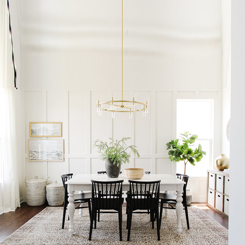 Tabitha Chandelier By Mitzi - Aged Brass Hanging above Table